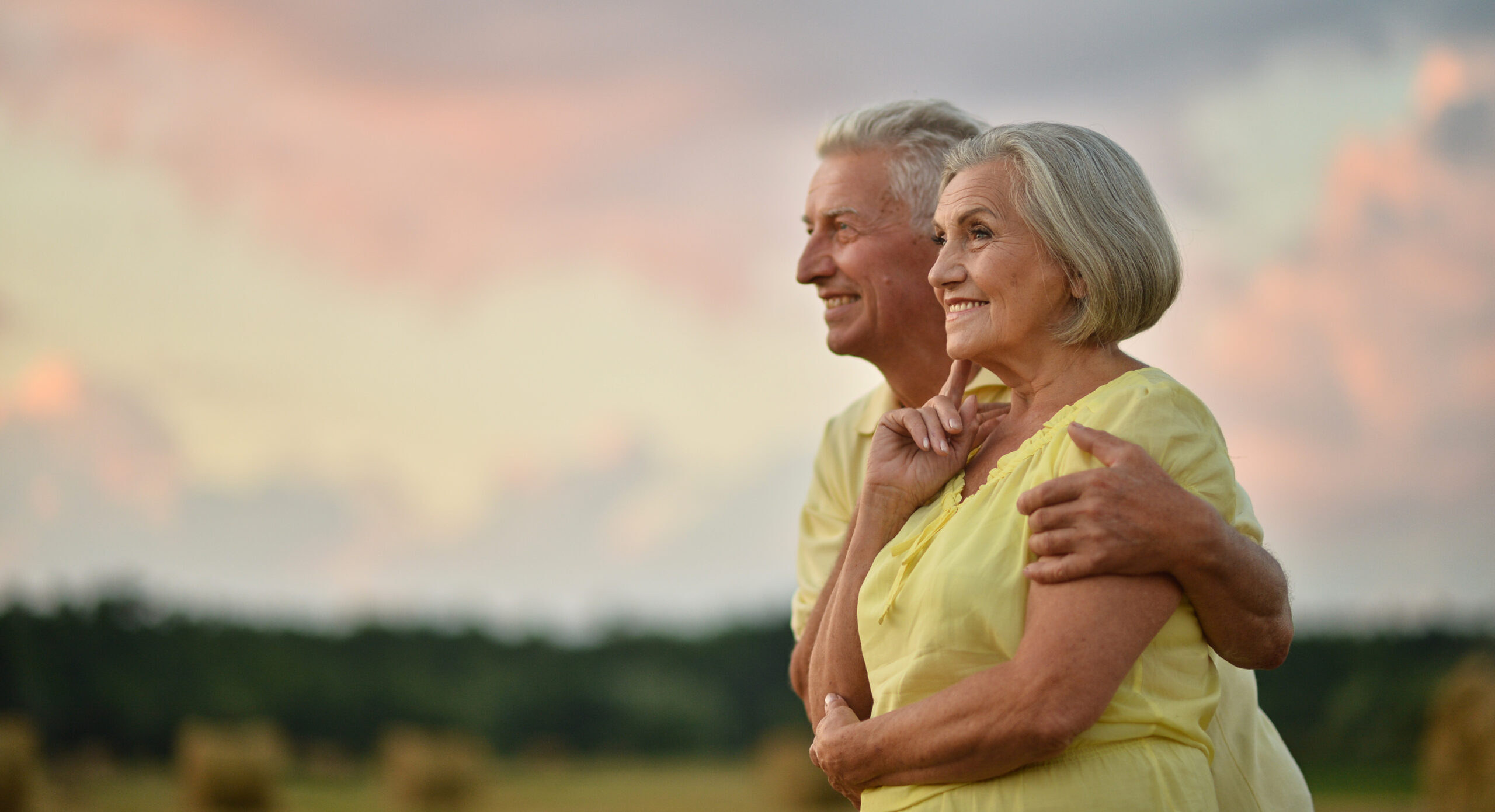 elderly couple on the background of sky